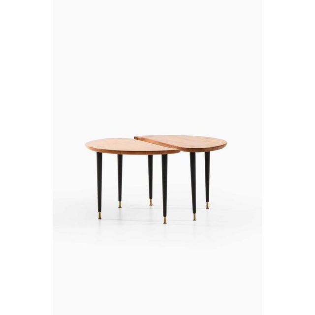 This rare pair of side or coffee tables, produced by Svensk Fur in Sweden, captures the essence of mid-century...