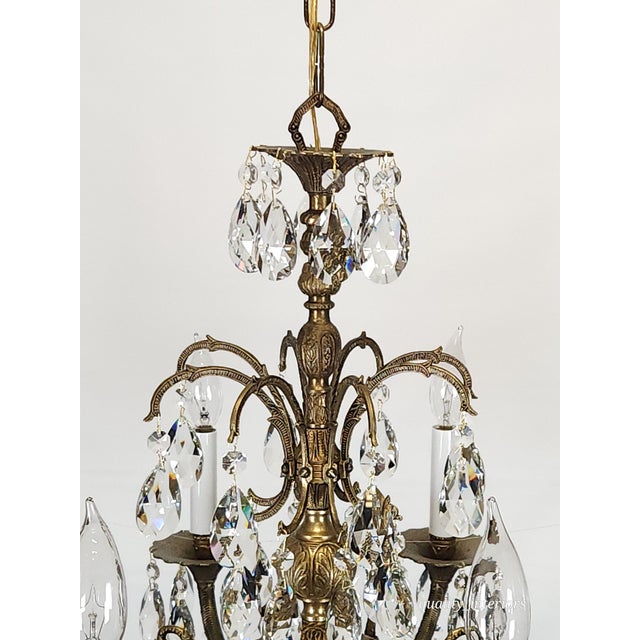 Offered for your consideration is an original Antique 8 Arm Sweet Sensational Brass Cut Lead Glass Crystal Chandelier. The...
