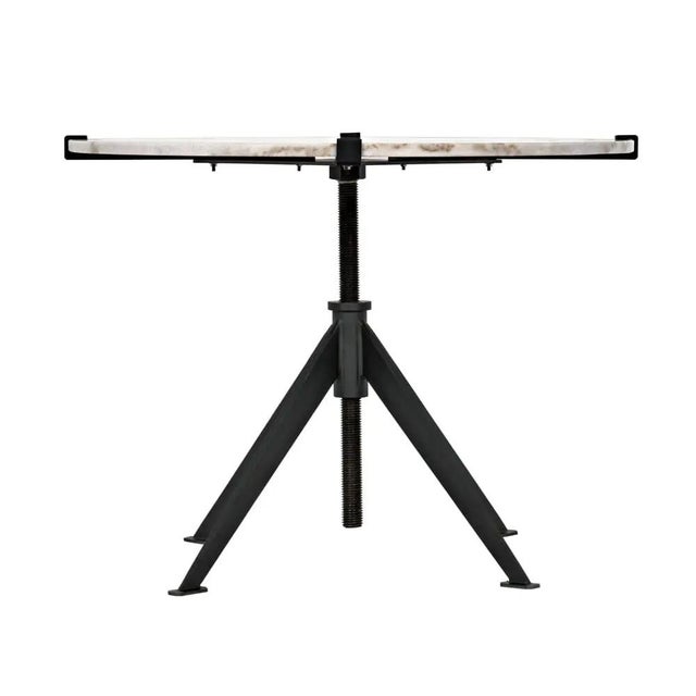 An updated take on mid-century modern, this table is topped with a slab of marble and designed to embrace the beauty of...