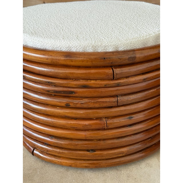 A sculptural pair of Mid-20th Century bent stacked rattan ottoman footstools in the manner of Paul Frankl. These vintage...