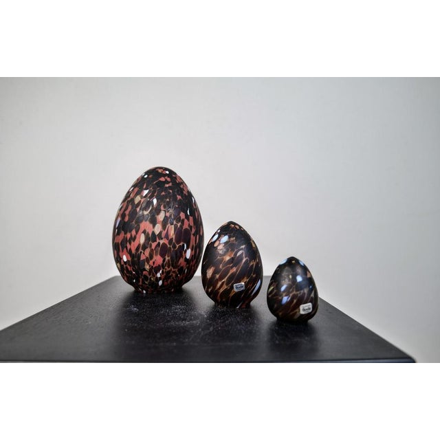 This set of 3 eggs with a swelling shape and mottled brown surface was designed by Monica Backström. They are al unique...