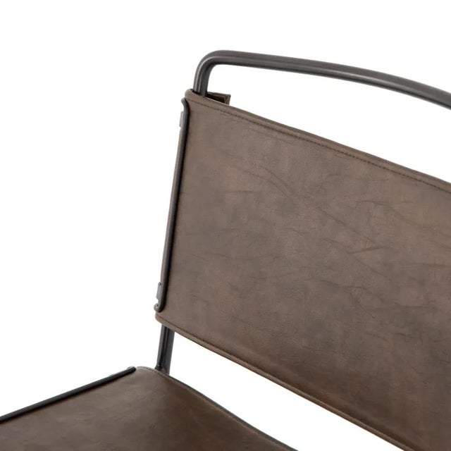 Slim lines and mixed materials combine for ample comfort. Architecturally inspired steel tubing is graced by simply...