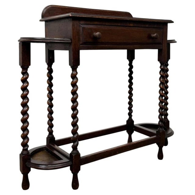 A handsome and beautifully crafted early 20th-century english edwardian hall stand, constructed in richly coloured oak and...