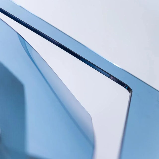 Sothis chandelier. Geometric glass structure. Metal details. Halogen bulb lighting. Excellent condition, shows no signs of...