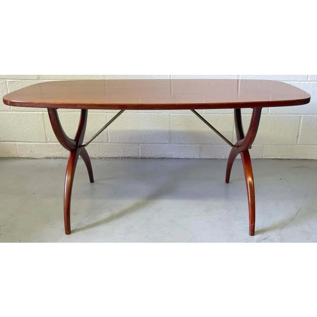 Modern Mahogany & brass coffee table Designed by Yngve Ekström, for Westbergs Möbler Sweden, Circa 950s A understated...