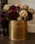 A generously scaled vintage English brass jardinière or cachepot featuring delicate neoclassical-inspired bow, garland and...
