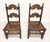 An antique pair of Gothic Revival style dining side chairs by Grand Rapids Bookcase and Chair Company. Solid oak with...