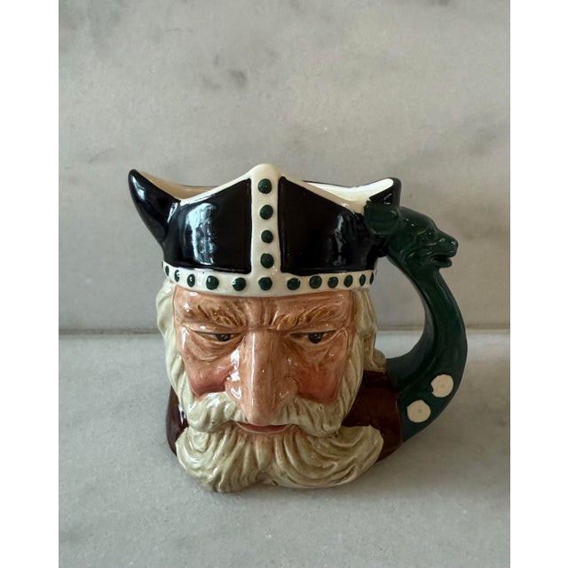 Vintage Royal Doulton Viking small 4" hand painted mug with horned helmet and sea serpent handle. Part of the "Men of...