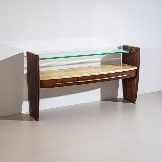 Wall console with rosewood veneer and a lacquered shelf covered in parchment. Above it is a glass shelf, and below are...