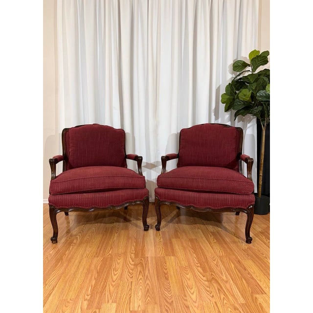 This is a beautiful set of Henredon upholstered chairs in a rich burgundy fabric with elegant French style wood framing....