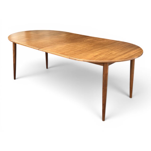 Beautifully restored, this Mid-Century Modern teak dining table embodies the clean lines, exceptional craftsmanship, and...