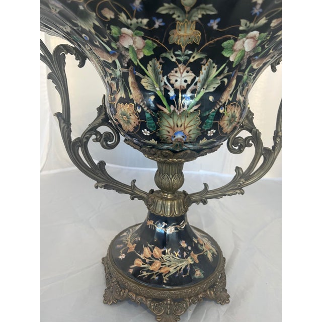 Miramar‑Style Porcelain & Bronze Centerpiece Elegant Miramar‑inspired centerpiece combining smooth porcelain with ornate...