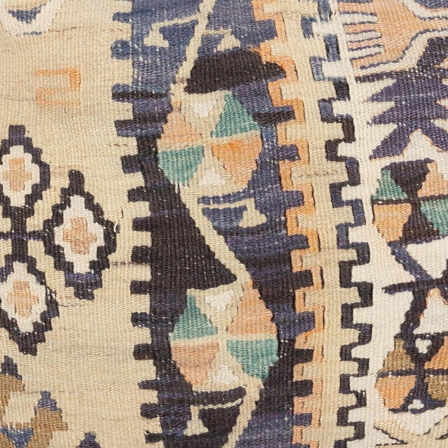Add a touch of history and warmth to your space with this vintage handmade Turkish wool kilim cushion cover. Crafted from...