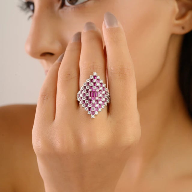 Add a touch of luxury and sparkle with this Sterling Silver Marquise Cluster Ring, elegantly set with vibrant pink and...