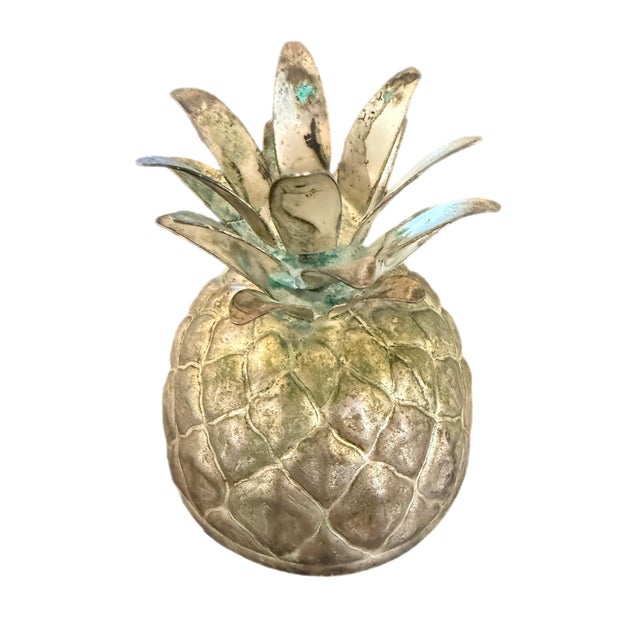 Iconic vintage pineapple ice bucket featuring a textured glass body and sculptural metal lid with dimensional frond...