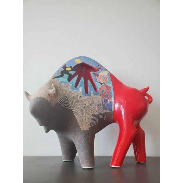 A uniquely brilliant American ceramic sculpture capturing the essence of a buffalo, in southwestern modern style by...