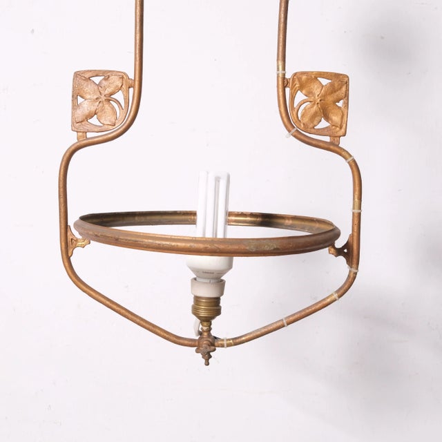 Antique Art Nouveau lantern chandelier, composed of a long stem, with two side decorations framing the milk glass shade....