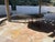 This is a generous sized custom made granite top dining table for outdoor/indoor use. The frame is iron and the top is...