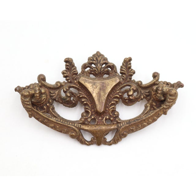 Victorian style dresser drawer pull made of brass with a patina finish. Mounting screws are included. Good condition with...