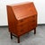 Beautiful teak secretary desk in teak. Comes with a drop down desk surface as well as 3 large storage drawers below and...