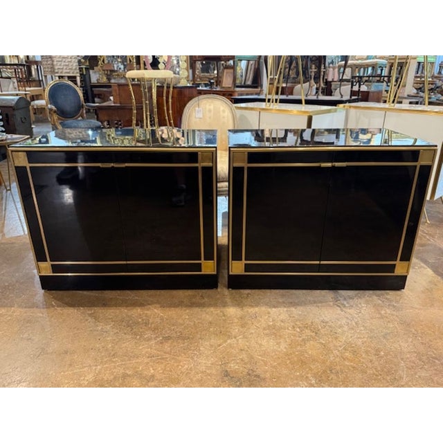 Good pair of Pierre Cardin manner piano black and brass side cabinets. Side cabinets in the manner of Pierre Cardin are...