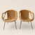 An exceptionally sculptural pair of unmarked mid-century modern lounge chairs crafted in the style of Paul McCobb. Sinuous...