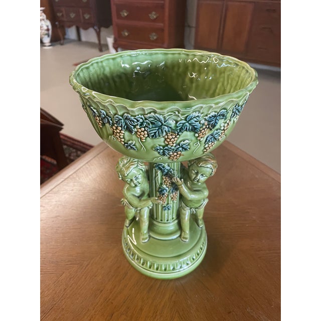 Vintage 1950s green ceramic cherub bowl by Fenton measuring 11.5"H x 8"W.