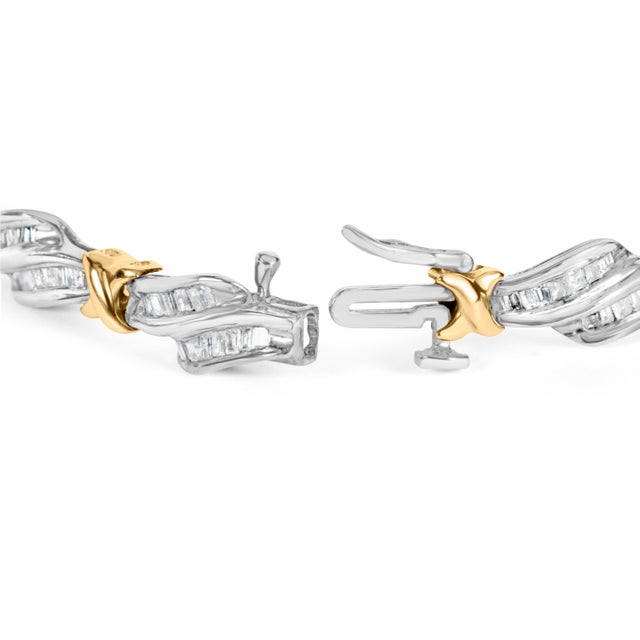 Indulge in the luxurious elegance of this stunning diamond link bracelet. Crafted from 10k two-toned gold, this piece...