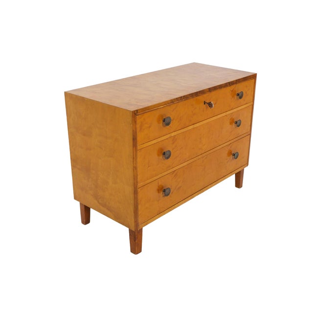 Hand-crafted in the 1940s in Sweden, this birch chest offers ideal storage space with its three full-length drawers....