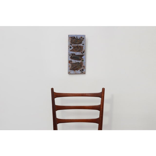 A charming mid‑century ceramic wall panel featuring four stylized birds in relief, designed and produced by Amphora,...