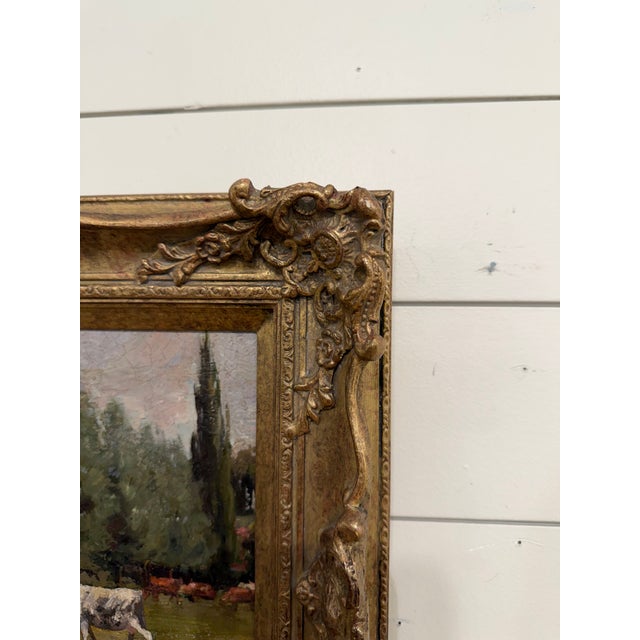 This is a 19th Century Impressionistic-style landscape oil featuring a pastoral field with cows grazing in the distance....