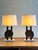 Pair of unique table lamps, Hollywood Regency style, black lacquer and brass and a giant ammonite (>20 cm diameter)....
