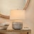 Cocoon Table Lamp, White Washed Bamboo Supremely stylish yet eminently approachable, this hand-crafted table lamp, with...