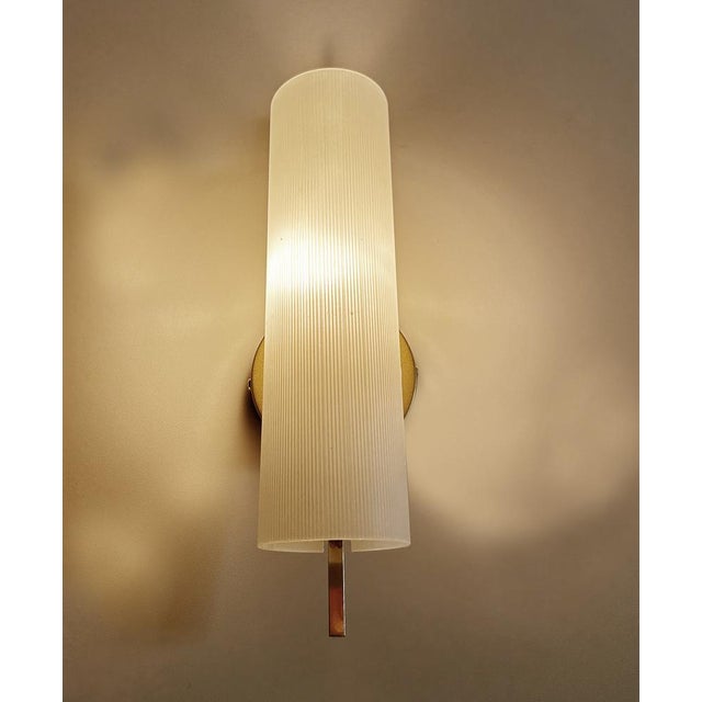 Mid Century Sconce from the 1950s , brass structure with cylindrical opaline glass shade Dimensions Width: 10 cm / 3.93"...
