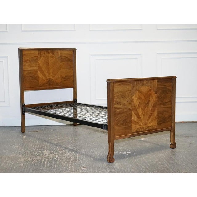 Art Deco Single Bed. A stunning design characterized by its richly textured burr walnut wood, exuding elegance and...