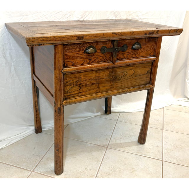 Great antique Asian style altar table from the early 20th century. It's likely made of elm or a similar hardwood with an...