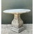 Built from solid cast cement, this vintage pedestal table presents a commanding architectural silhouette defined by raw,...