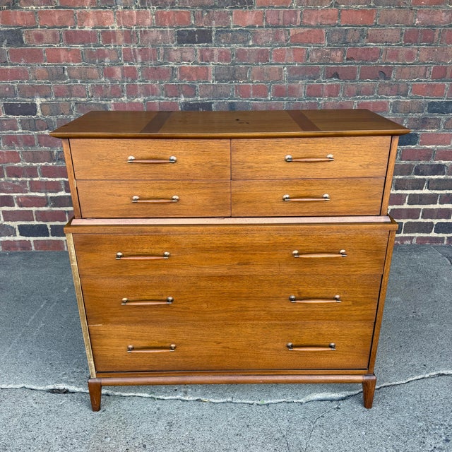 This is a tall boy Henredon Heritage Collection chest of drawers. It features 4 smaller drawers at the top tier and 3...