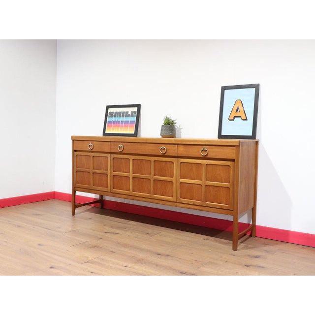A fabulous piece of mid century furniture by British furniture maker Nathan, this Vintage Teak Credenza Sideboard...