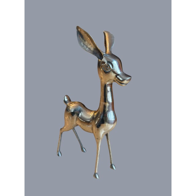 These are vintage large-sized mid-century modern brass deer sculptures, often referred to as a "Bambi" set, consisting of...
