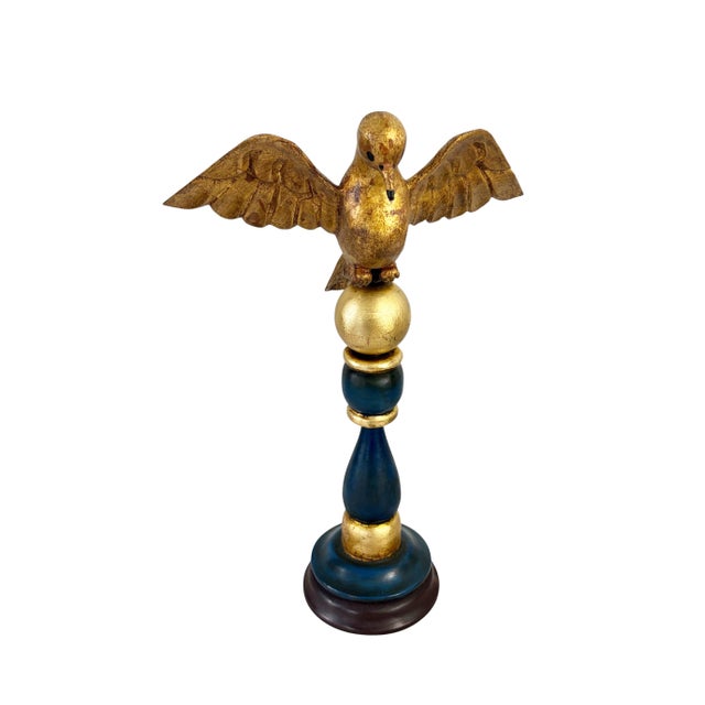 Add a playful touch to your space with this unique European hand-carved wood bird sculpture. Standing majestically on a...