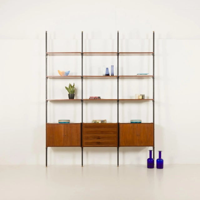 This italian mid century bookcase was designed in the 1960s and closely remains franco albini's projects from the same...