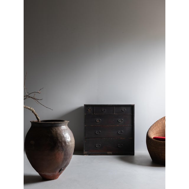 This piece is a Japanese chest of drawers crafted during the late Meiji to early Taisho period. It is constructed from...