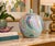 Striking decorative Chinese ginger jar featuring a soft celadon green ground with an intricate multicolor design in pink,...