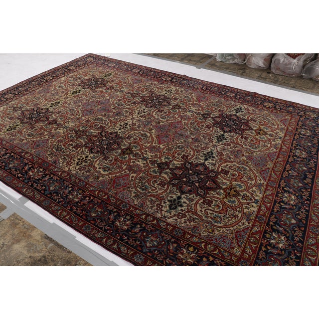 Hand-knotted in wool and originating circa 1920-1930, this 8x12 antique rug from Rug & Kilim’s latest acquisitions...