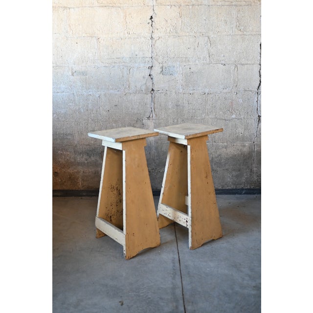 Matching pair of French country style plank wood plant stands circa 1950. Simple tapered frames and square tops, painted...