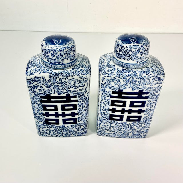 This pair of Chinoiserie Square Ginger Jars feature a hand-painted Happiness symbol on two sides. They also have an...