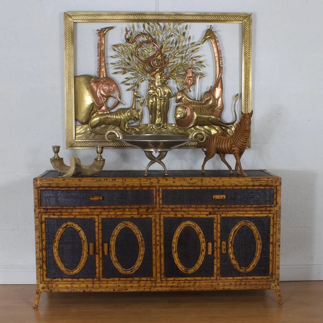 Midcentury silvered metal and brass bowl set on a hammered sculptural metal stand with four legs and brass ball feet. The...