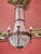 Restored castle chandelier made of bronze, hand-cut and polished crystal and glass lampshades in the shape of a torch. The...