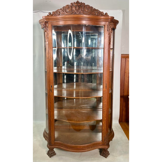 Antique Carved NorthWind Face Tiger Oak Bow Front China Chairish